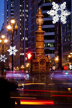 Festive lighting displayed along Third Street and Market Street.