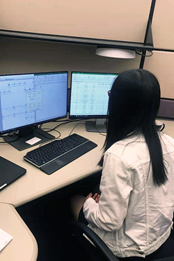 Phoebe Chen working at a computer during her internship at Brown and Caldwell in 2019.