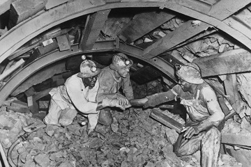 tunnel workers shaking hands