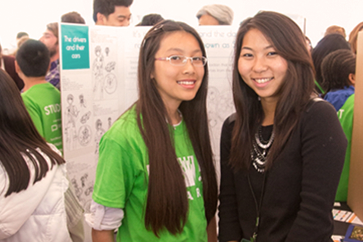 two female students standing shoulder to shoulder