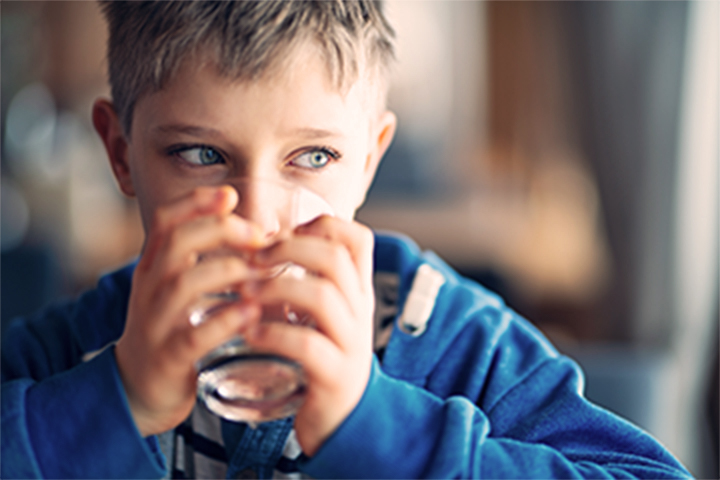 Boy drinking tap water