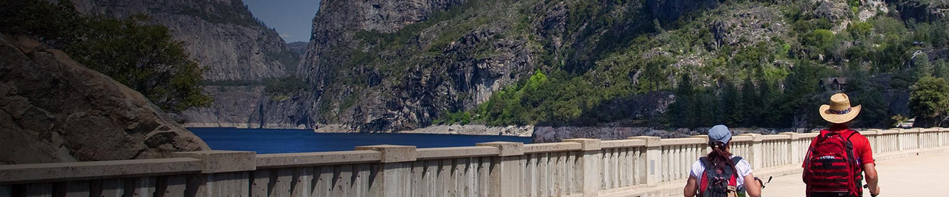Couple walking at Hetch Hetchy Dam and Reservoir